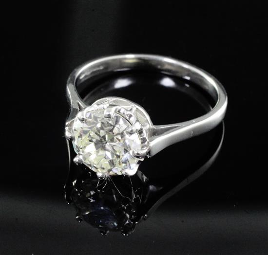 A modern platinum and solitaire diamond ring, size Q.